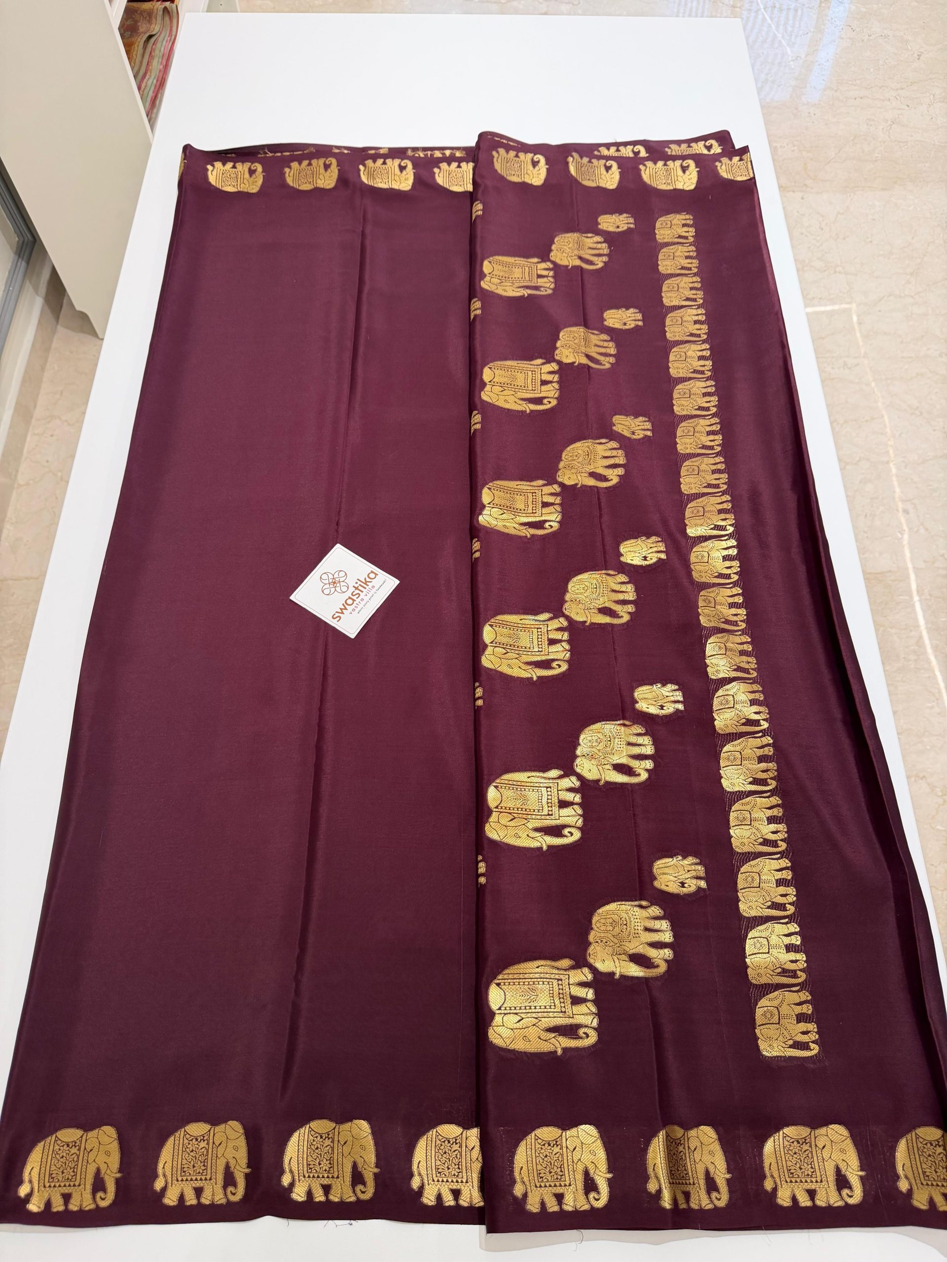 Pure Mysore Silk Saree - (A rich silk saree featuring elegant gold elephant motifs along the border and pallu, a classic traditional charm.)